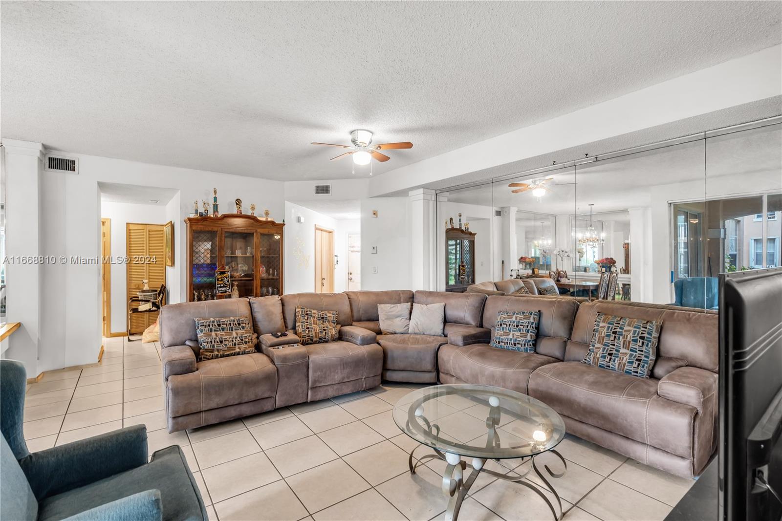 14807 Balgowan Road, Unit 10212 Miami Lakes, FL 33016 - Photo 3 of 32 a living room with furniture and a large window