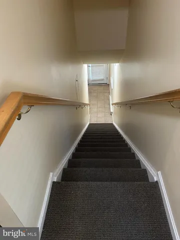 a view of front door with wooden floor