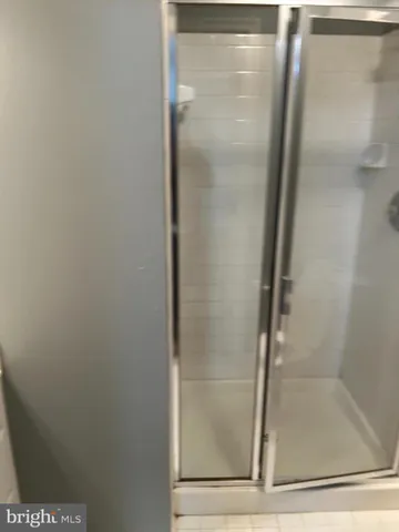 a view of room with stairs and wooden floor