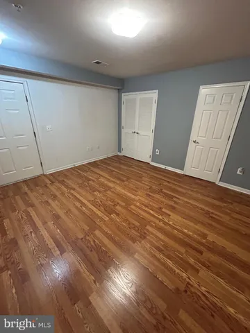 a bathroom with a white bath tub and a shower