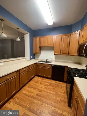 a view of a kitchen from the hallway