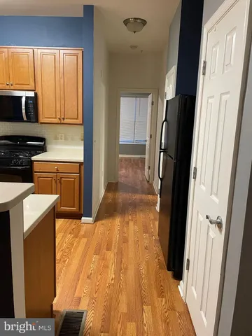 a close view of a stove top oven and cabinets