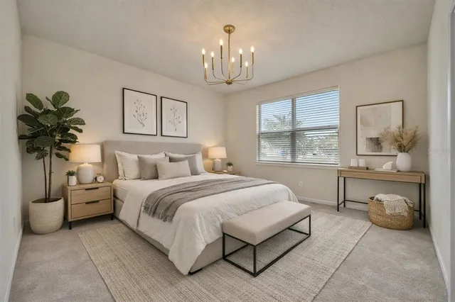 a spacious bedroom with a bed and window