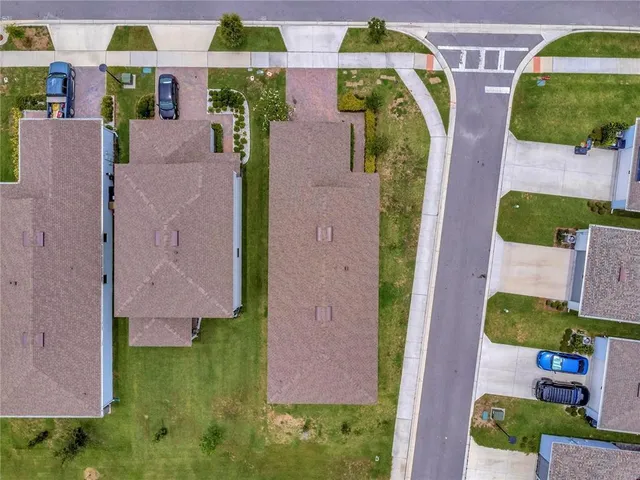 an aerial view of residential house with outdoor space and swimming pool