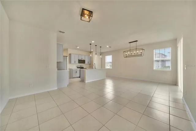 a view of an empty room and a window