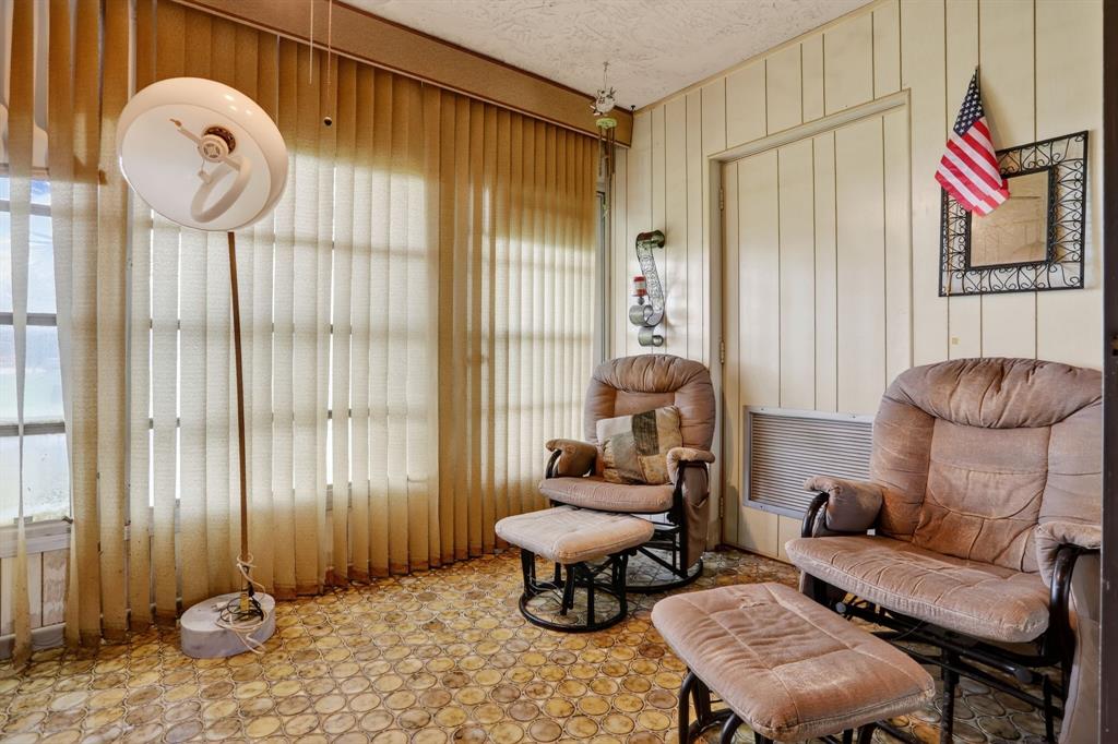 7360 Northwest 18th Street, Unit 103 Margate, FL 33063 - Photo 13 of 24 a living room with furniture and a window