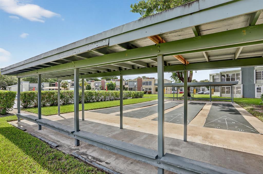 7360 Northwest 18th Street, Unit 103 Margate, FL 33063 - Photo 24 of 24 a view of a swimming pool with a porch