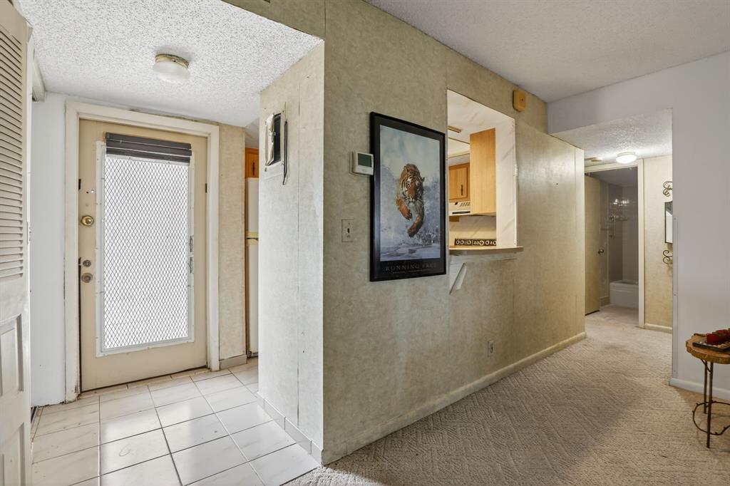 7360 Northwest 18th Street, Unit 103 Margate, FL 33063 - Photo 3 of 24 a view of a hallway with wooden floor