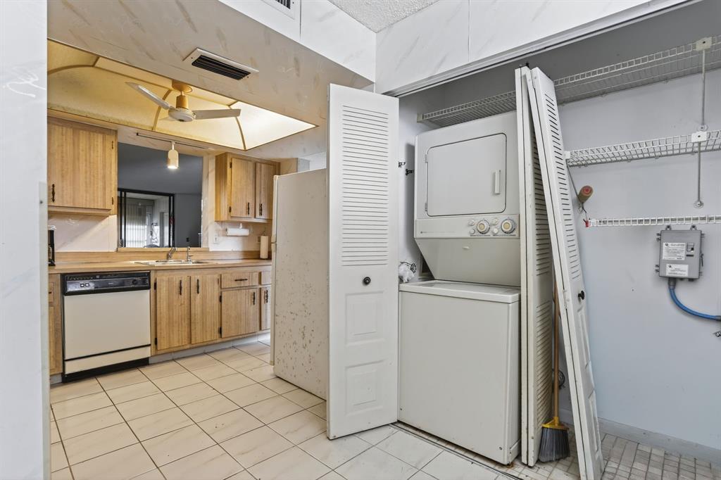 7360 Northwest 18th Street, Unit 103 Margate, FL 33063 - Photo 7 of 24 a kitchen with a refrigerator and a sink