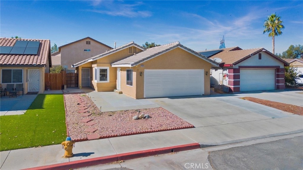 14836 Carter Road Victorville, CA 92394 - Photo 1 of 1 front view of a house with a yard