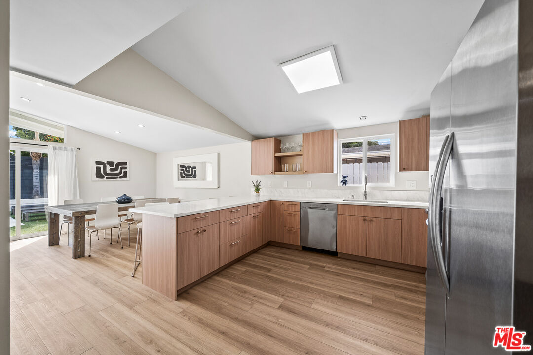 20308 Mobile Street Winnetka, CA 91306 - Photo 22 of 28 a large kitchen with a lot of counter space