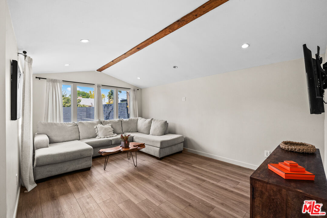 20308 Mobile Street Winnetka, CA 91306 - Photo 24 of 28 a living room with furniture and wooden floor