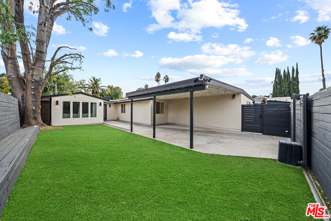 20308 Mobile Street Winnetka, CA 91306 - Photo 28 of 28 a view of a backyard with a garden