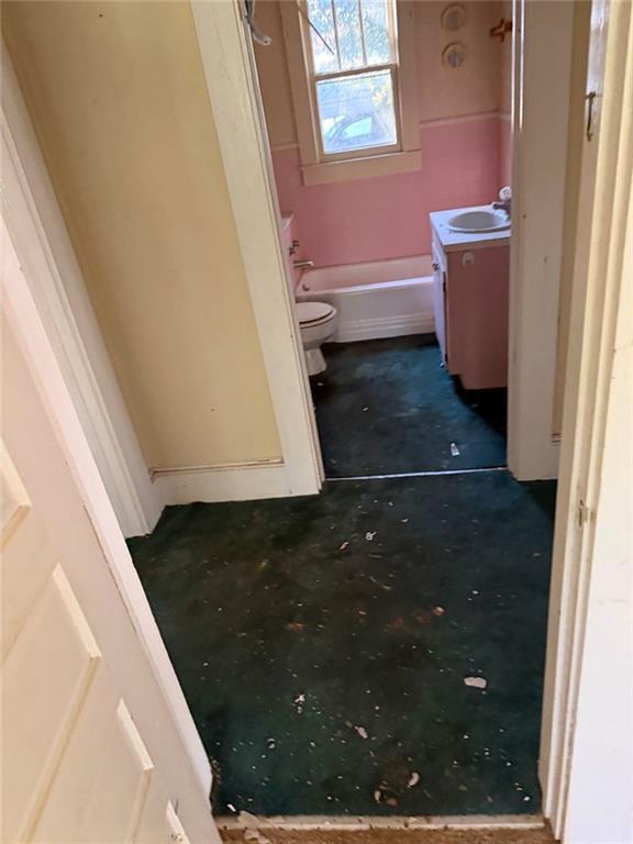 320 West Magnolia Street Fitzgerald, GA 31750 - Photo 10 of 14 a bathroom with a sink and a toilet