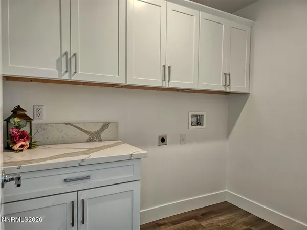 a view of cabinets and wooden floor