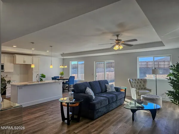 a living room with furniture and a chandelier