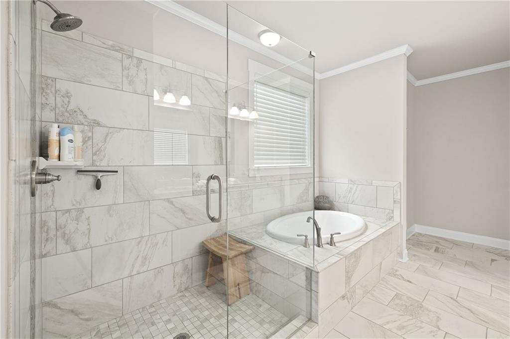 2440 Traditions Way Jefferson, GA 30549 - Photo 12 of 32 a bathroom with a sink toilet a mirror and shower