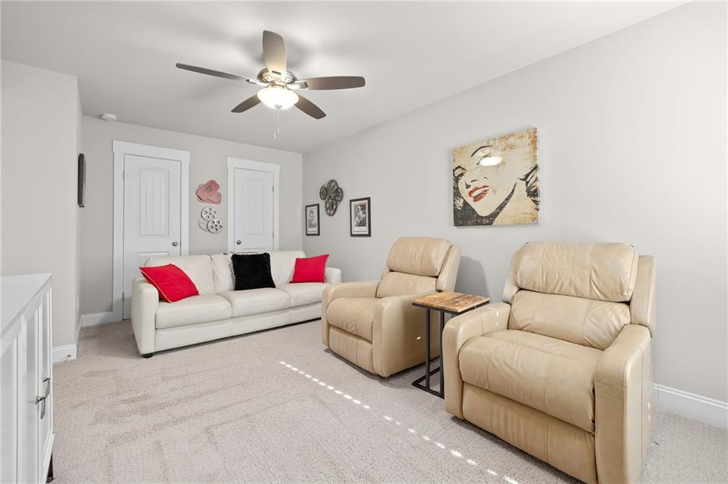 2440 Traditions Way Jefferson, GA 30549 - Photo 18 of 32 a living room with furniture and white walls