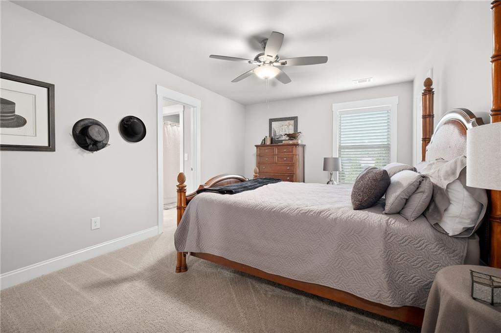 2440 Traditions Way Jefferson, GA 30549 - Photo 21 of 32 a bedroom with a bed and a window