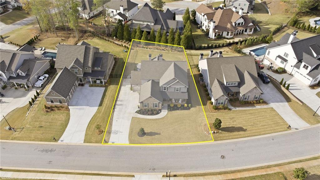 2440 Traditions Way Jefferson, GA 30549 - Photo 25 of 32 an aerial view of a house with a swimming pool