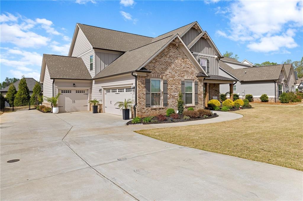 2440 Traditions Way Jefferson, GA 30549 - Photo 3 of 32 a view of a house with cars park
