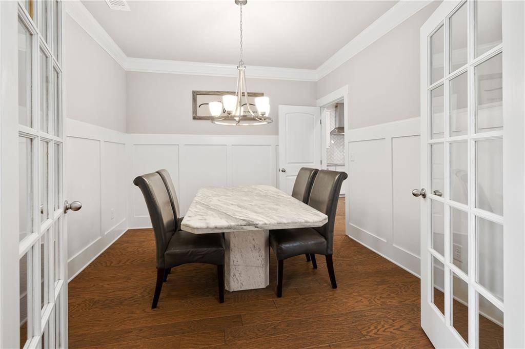 2440 Traditions Way Jefferson, GA 30549 - Photo 9 of 32 a view of a dining room with furniture and chandelier