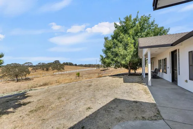 a large kitchen with a table and chairs