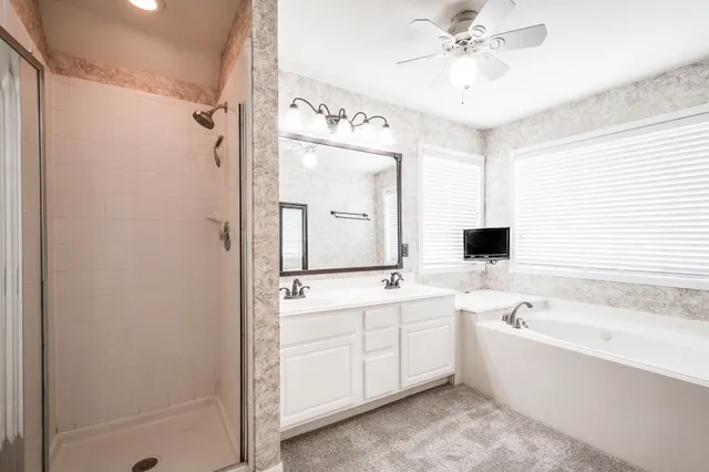 a bathroom with a double vanity sink and a mirror
