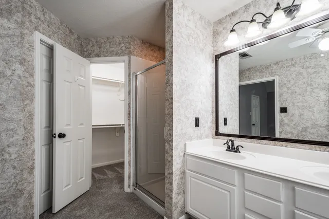 a view of a hallway with closet and entryway