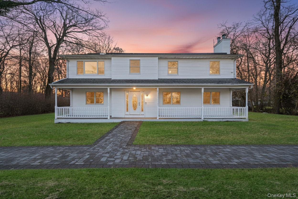 30 Half Mile Road Middle Island, NY 11953 - Photo 1 of 1 View of front of home featuring a porch, a chimney, and a yard