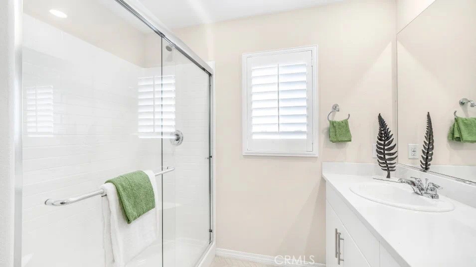 7464 Fig Grv Lane Riverside, CA 92507 - Photo 12 of 17 a bathroom with a sink and a mirror