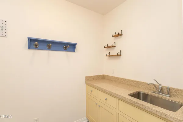 a bathroom with a sink and mirror