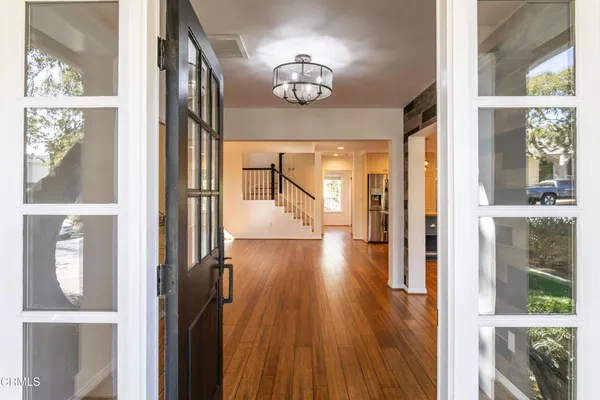 a view of gallery with wooden floor