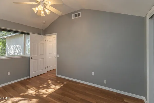 a view of an empty room with a window
