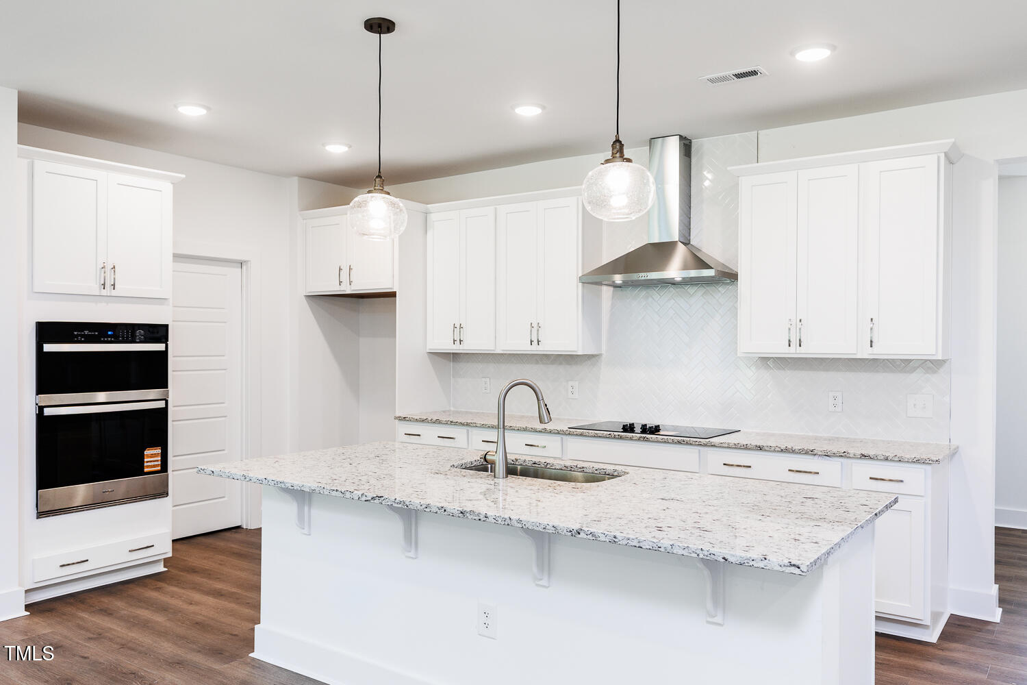 283 Golfview Avenue Four Oaks, NC 27524 - Photo 11 of 25 a kitchen with stainless steel appliances granite countertop a sink a stove and a refrigerator