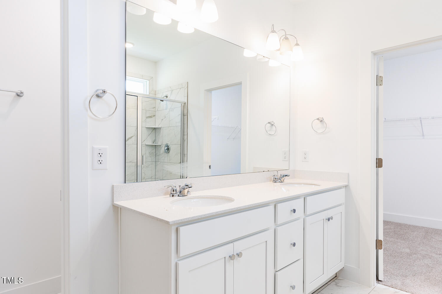 283 Golfview Avenue Four Oaks, NC 27524 - Photo 18 of 25 a bathroom with a sink double vanity and a mirror