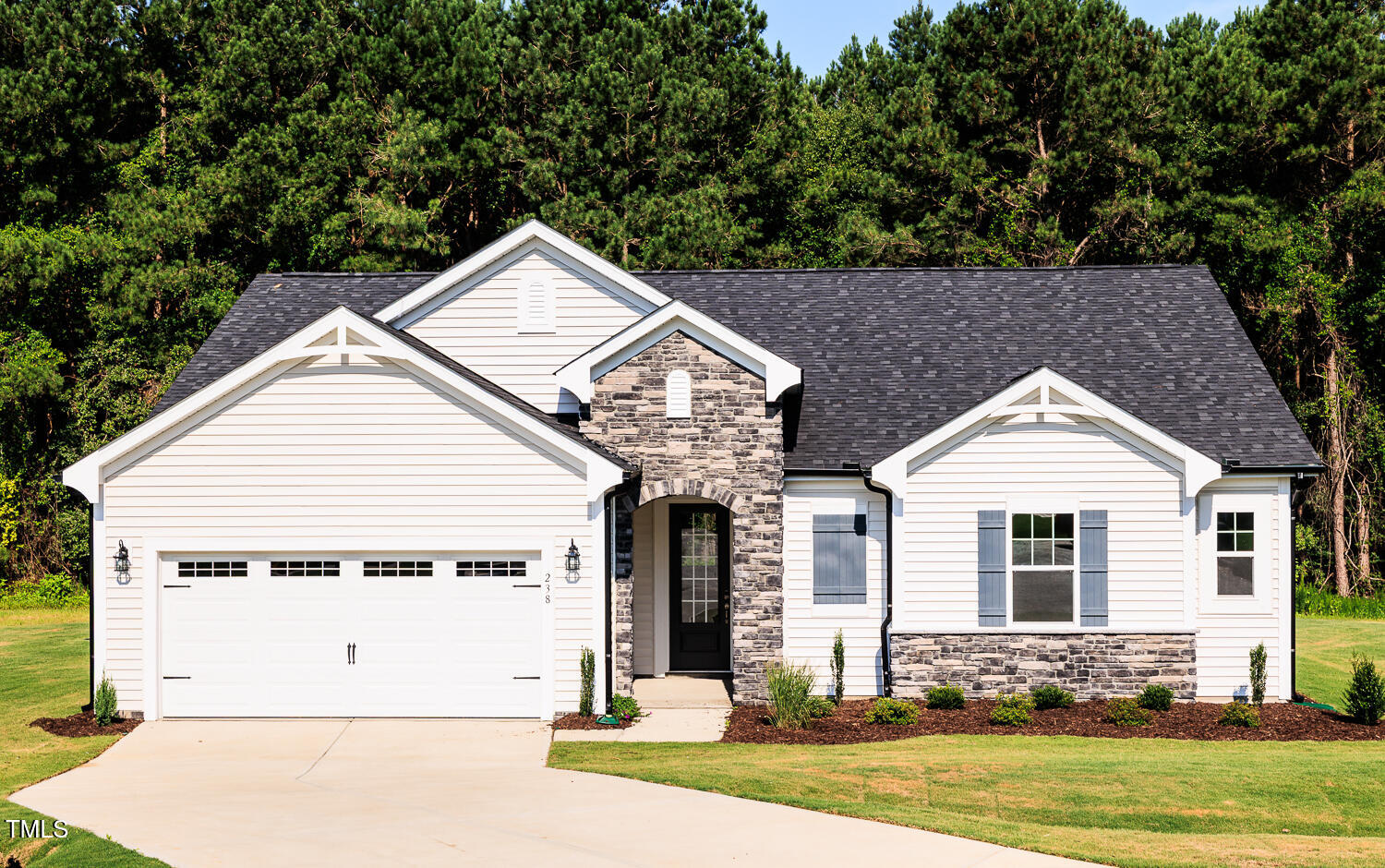 283 Golfview Avenue Four Oaks, NC 27524 - Photo 2 of 25 a front view of a house with garden