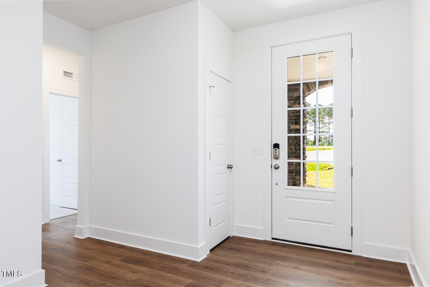283 Golfview Avenue Four Oaks, NC 27524 - Photo 8 of 25 an empty room with wooden floor closet and windows