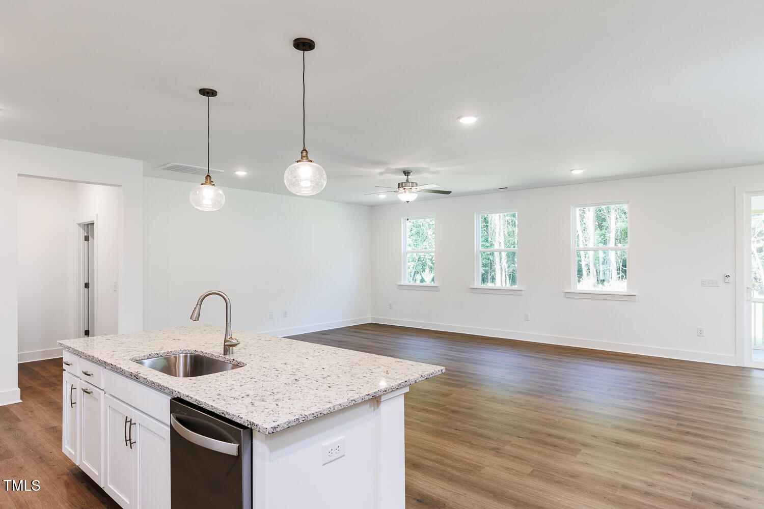 283 Golfview Avenue Four Oaks, NC 27524 - Photo 10 of 25 a kitchen with a sink chandelier and wooden floor