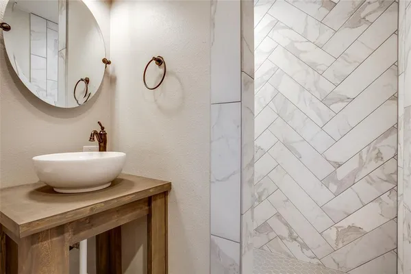 a view of a mirror with a sink and a mirror