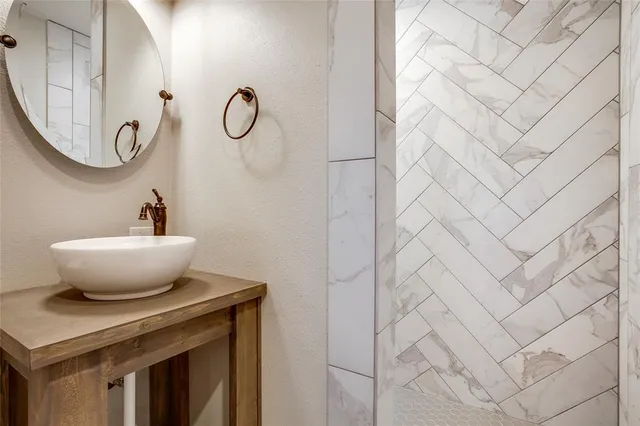 a view of a mirror with a sink and a mirror