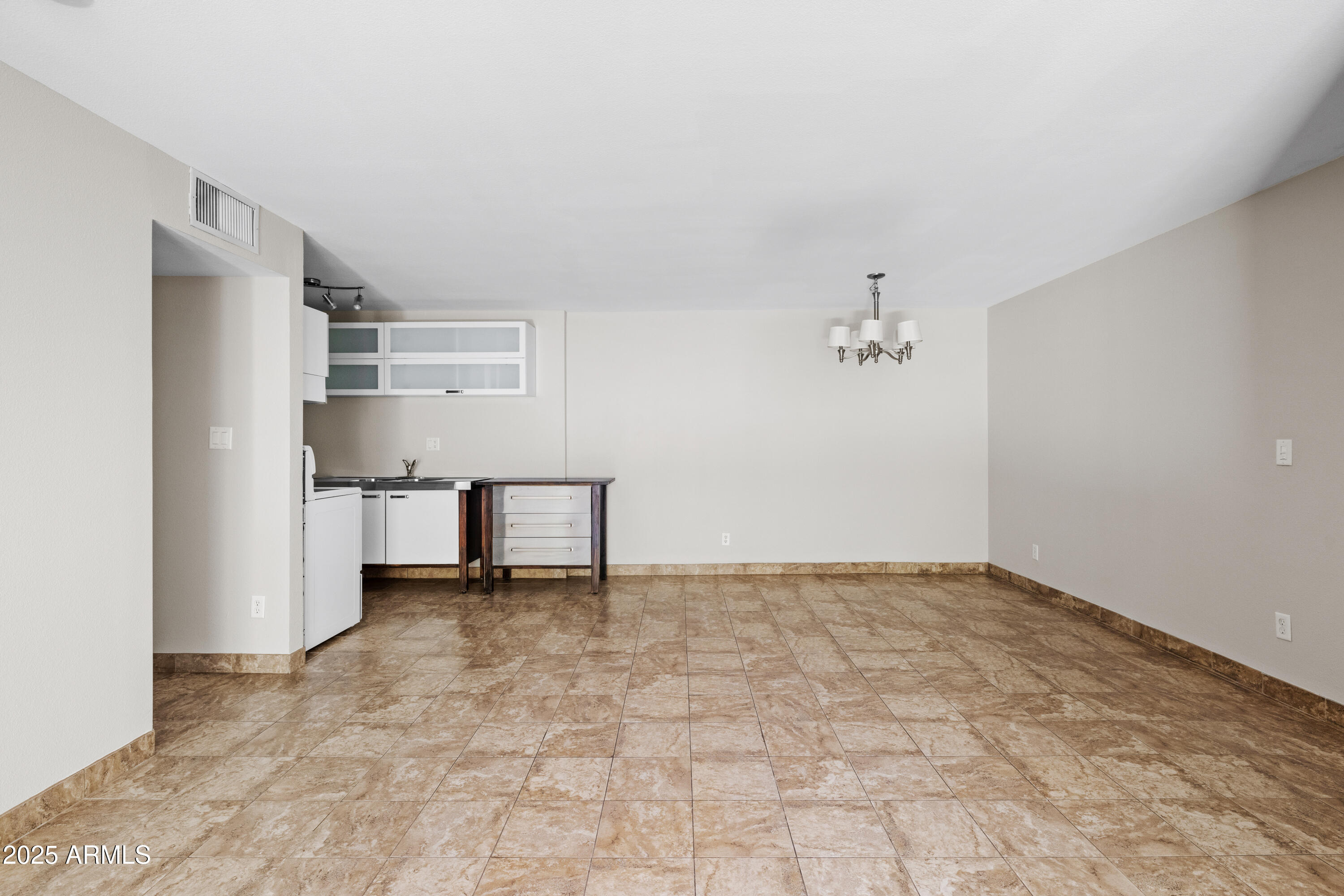 5525 East Thomas Road, Unit R11 Phoenix, AZ 85018 - Photo 4 of 15 a view of a kitchen with refrigerator and white walls