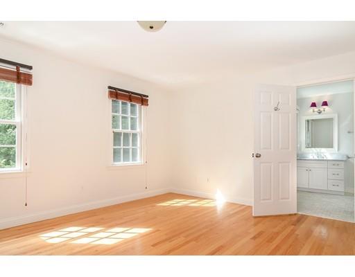 3 Dewing Path Wellesley, MA 02482 - Photo 13 of 25 a view of an empty room with window and wooden floor