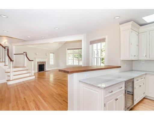 3 Dewing Path Wellesley, MA 02482 - Photo 4 of 25 a kitchen with kitchen island a stove a sink dishwasher and white cabinets with wooden floor