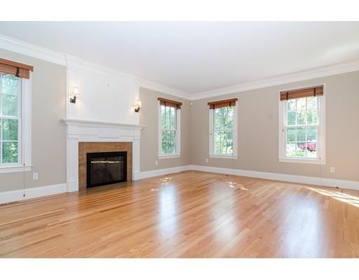 3 Dewing Path Wellesley, MA 02482 - Photo 6 of 25 a view of empty room with wooden floor and fireplace
