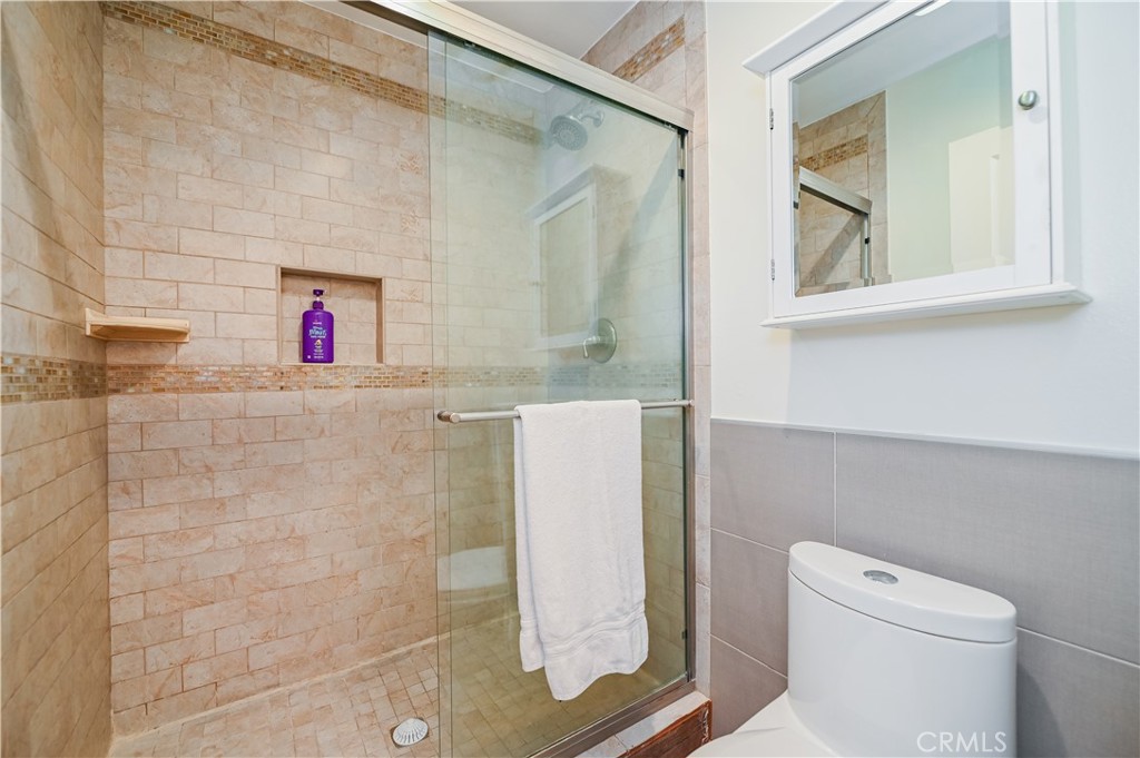 15 Camphor South Irvine, CA 92612 - Photo 11 of 28 a bathroom with a toilet and a shower