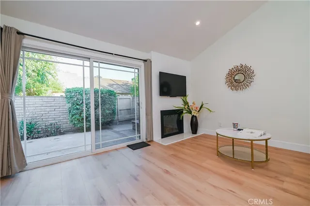 a living room with furniture a table and a clock