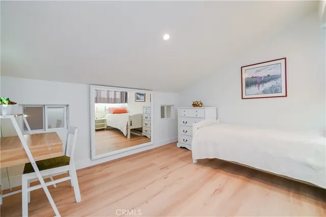 a room with furniture and a wooden floor