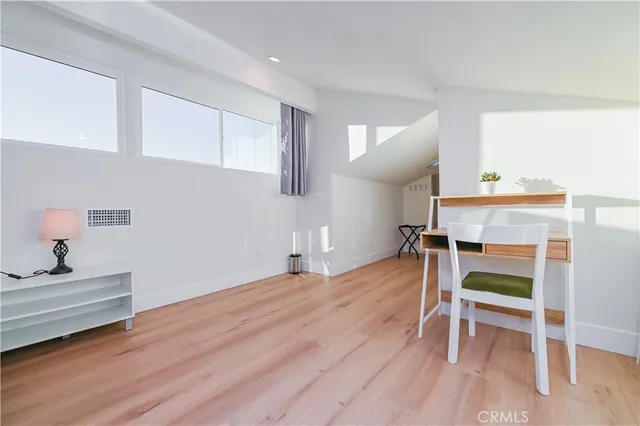 a bedroom with a bed and a table