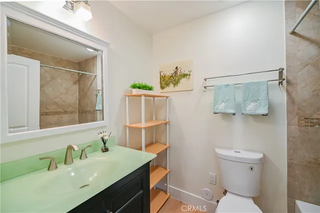 a bathroom with a toilet a sink and bathtub